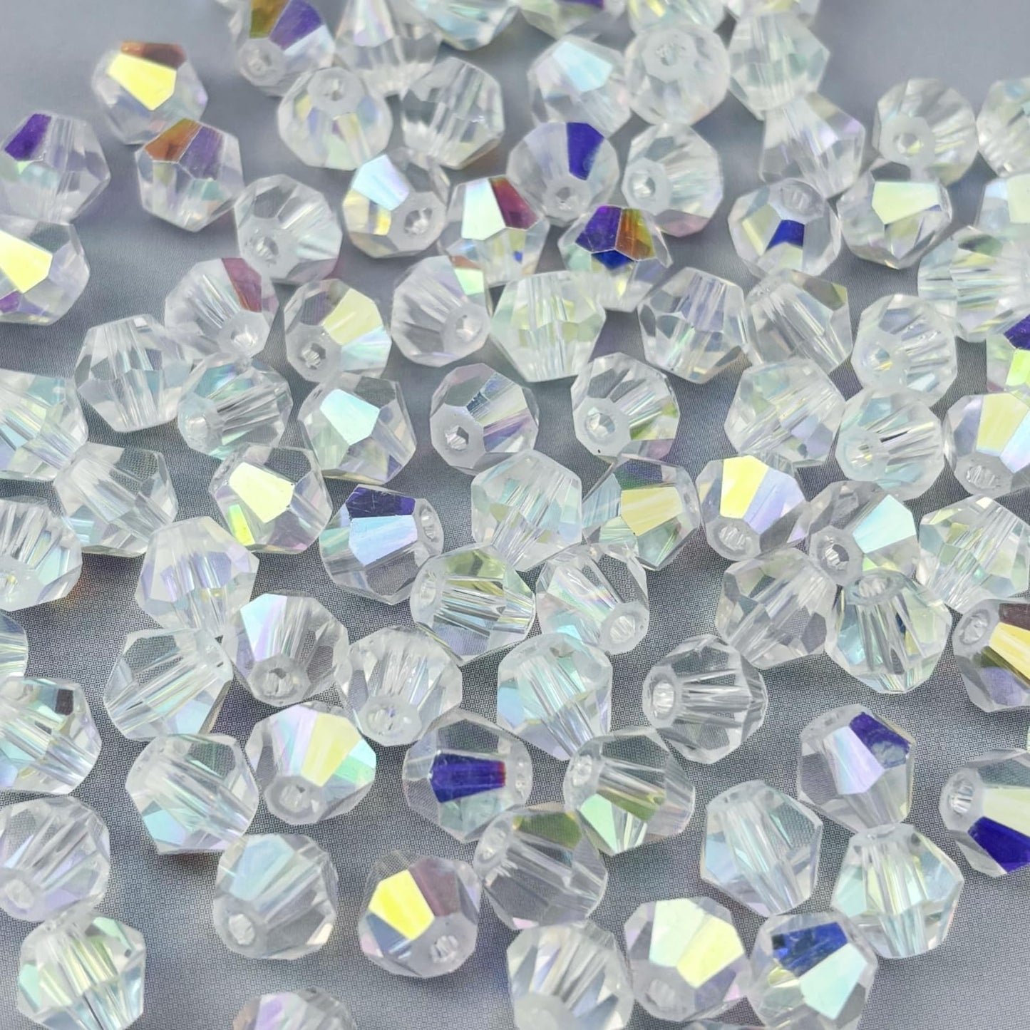 Pinhoollgo 600pcs 3mm Bicone Crystal Glass Beads Faceted Bicone Crystal Beads Bulk Glass Spacer Beads for Bracelets Necklace Pendants Earrings DIY Jewelry Craft Making(Crystal AB)